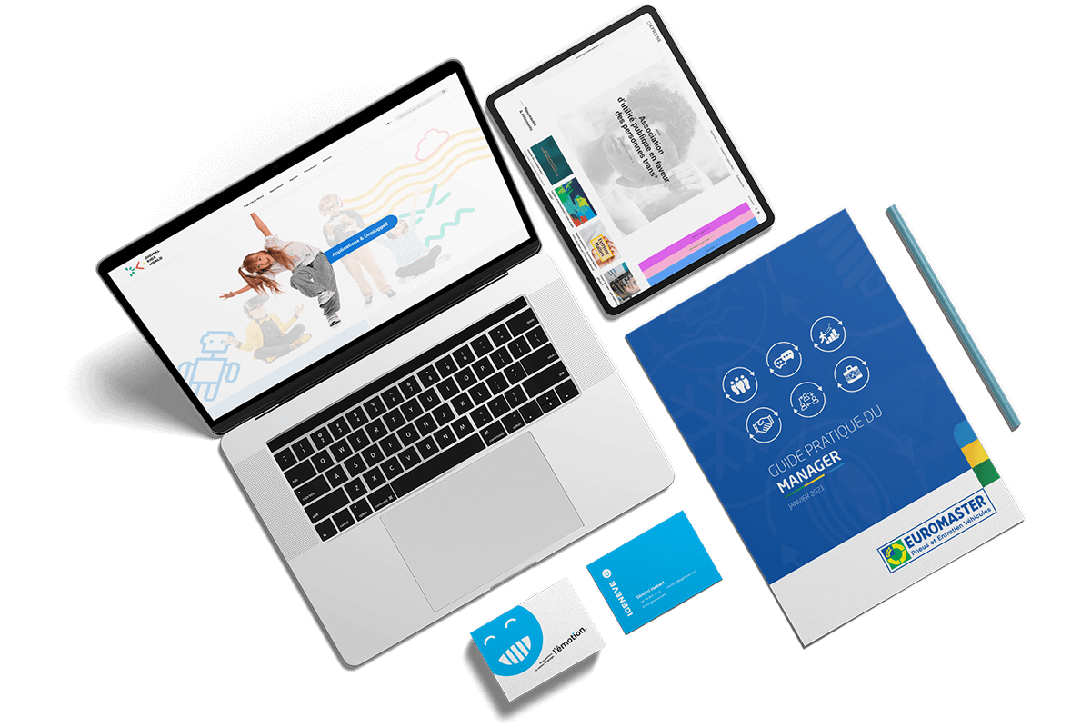 Ordinateur avec création de site, tablette avec site responsive, carte de visite et brochures réalisés par l'agence de communication igeneve